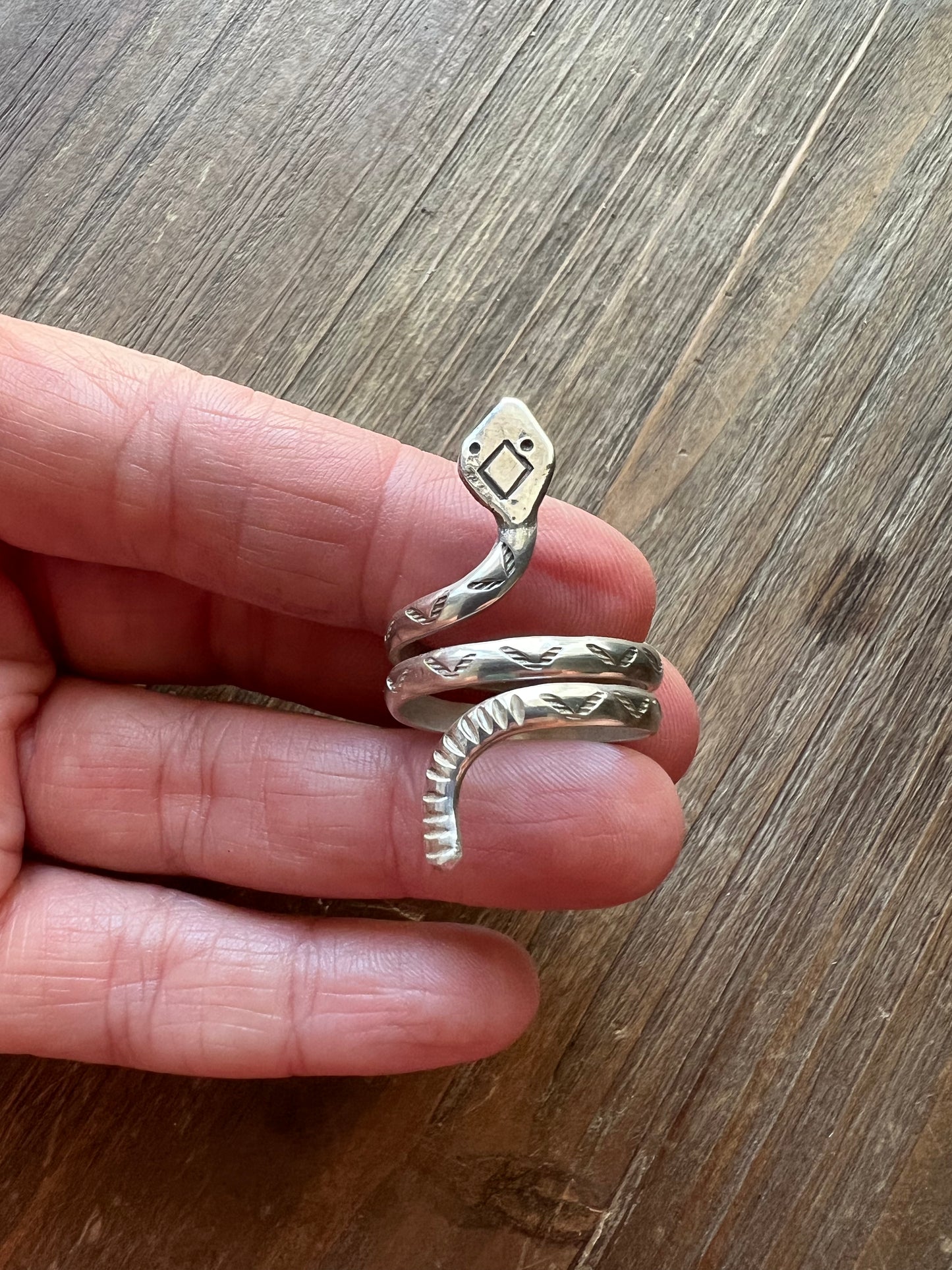 Hand stamped coil snake rings